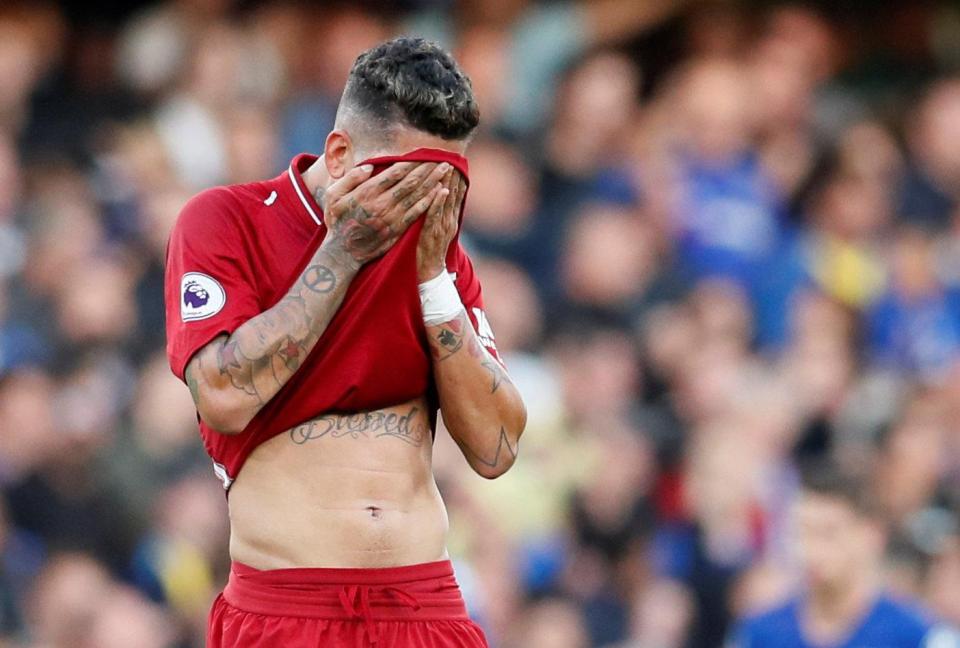  Roberto Firmino reacts after seeing his side fall behind