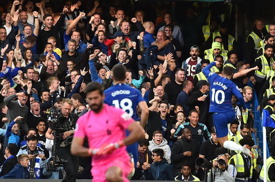  Eden Hazard celebrates after beating Alisson for the opener