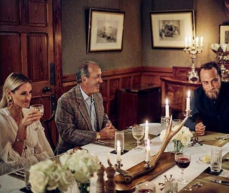  And another image shows him smiling in a rather posed scene with hotel guests at dinner