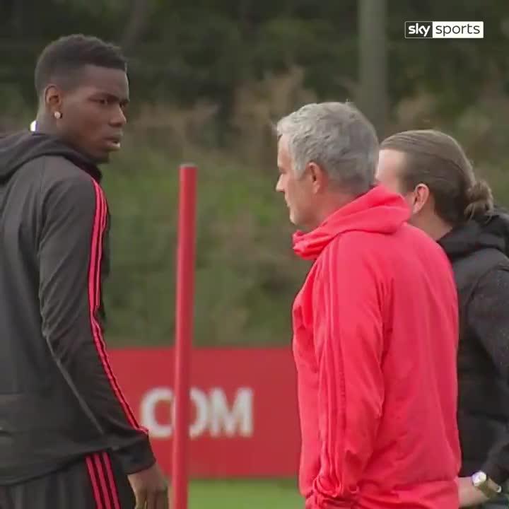  Paul Pogba stares down at boss Jose Mourinho at the training ground