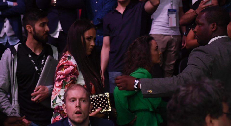  McGregor's pregnant partner Dee Devlin made a quick escape as the brawl kicked off