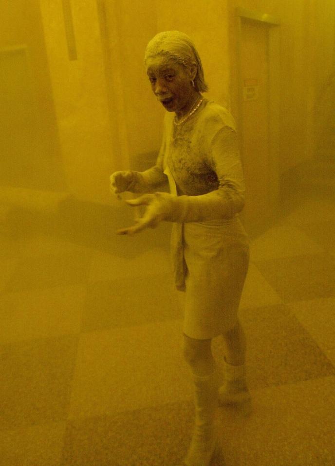  Dust was released into the air after the 9/11 tragedy in the US, with this famous image of a woman covered head to toe