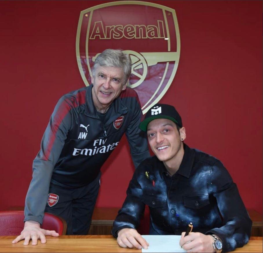  Arsene Wenger has urged Joachim Low to convince Ozil to return to the national team