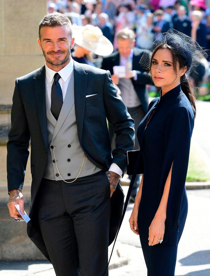  The former England footballer and his fashion designer wife at the wedding of Prince Harry and Meghan Markle