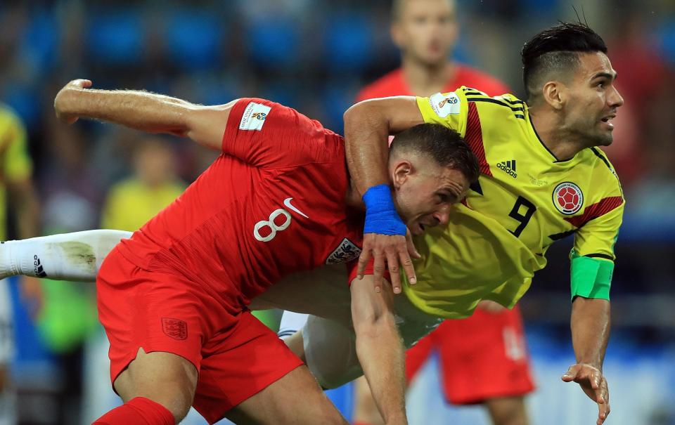  Jordan Henderson gets the rough treatment from Radamel Falcao before Colombia are knocked out of the World Cup