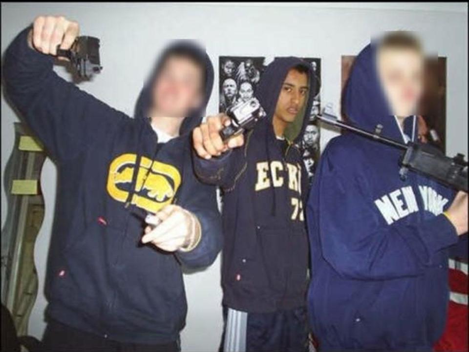  Apprentice hopeful Daniel Elahi poses with a gun in a gangland-style picture from when he was 15