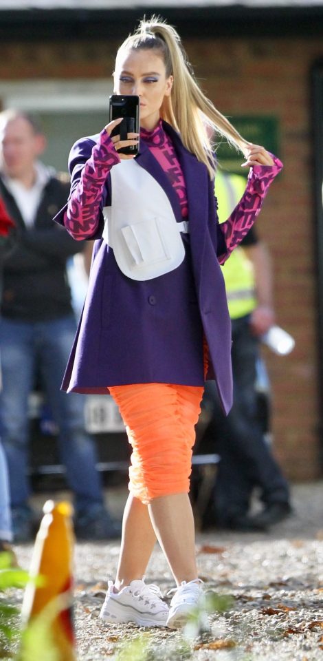  Perrie later donned a purple oversized blazer with a sheer orange skirt