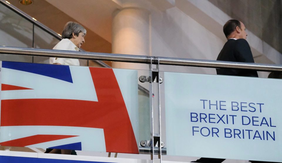  Mrs May walking through the conference centre in Birmingham