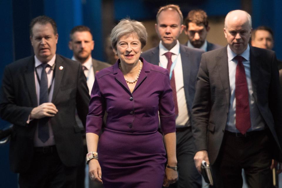  Mrs May with her aides at the conference yesterday