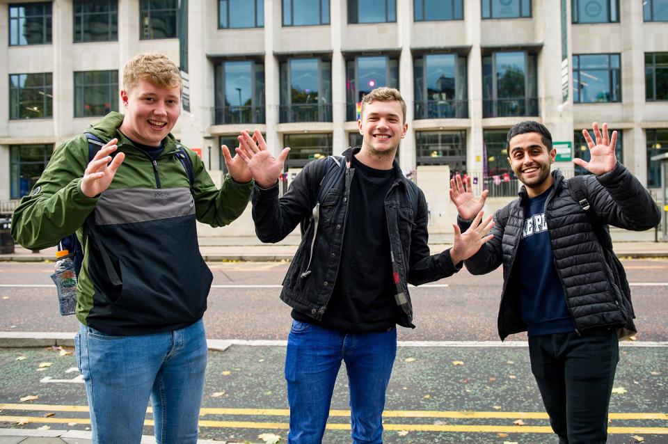  Pictured: Students perform jazz hands outside Union at the University of Manchester