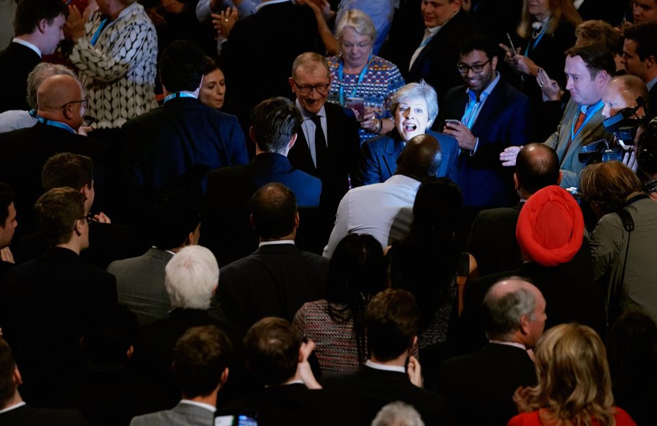  The Mays leaving the hall at the end of the speech