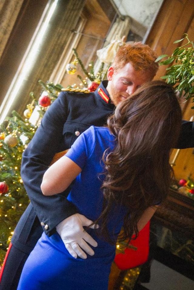  Prince Harry gets handsy with his new bride as they kiss under the mistletoe