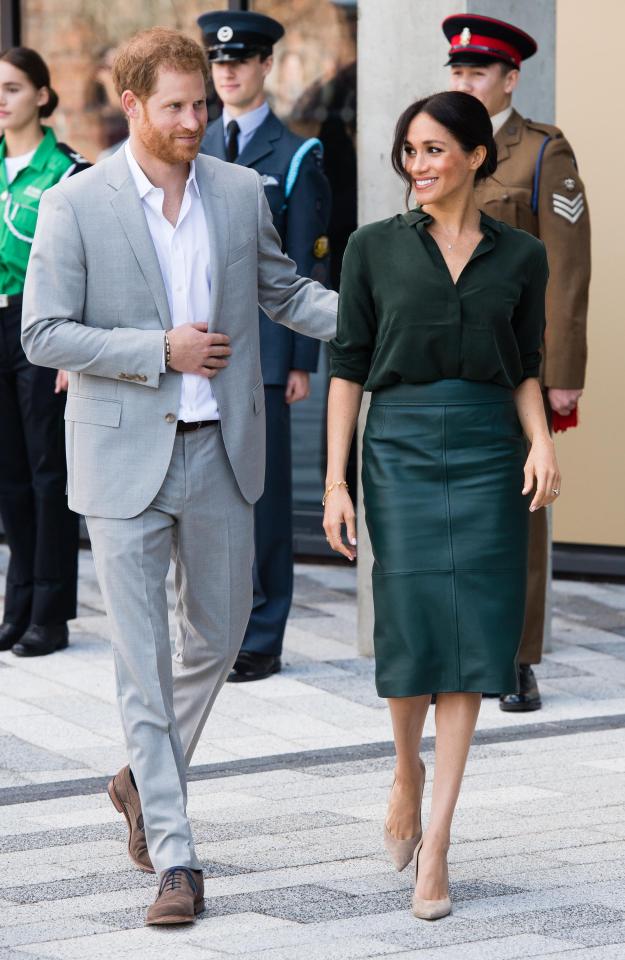  Harry was seen placing his hand on Meghan's back on a number of occasions