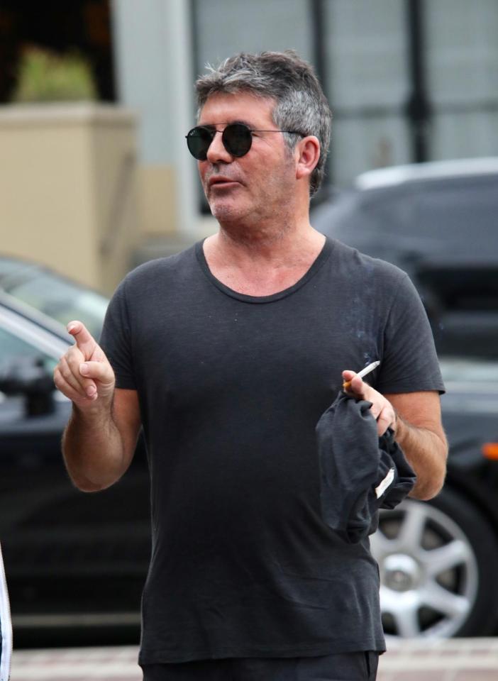  Simon puffed on his cigarette after he revealed that he was cutting down his smoking habit