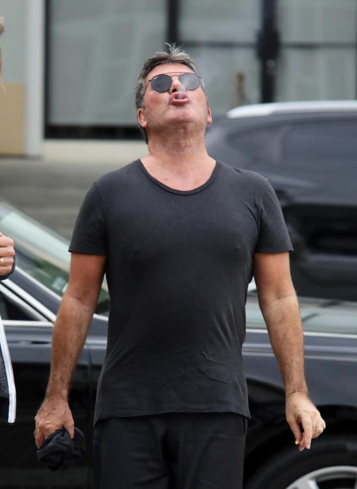  The TV star, 58, was pictured enjoying a cigarette break