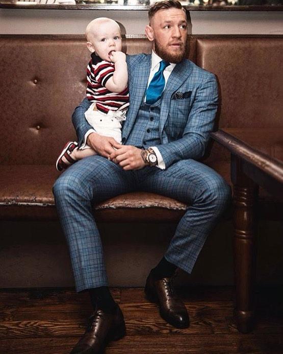  McGregor, with his son Conor Jr, wearing another David August three-piece suit