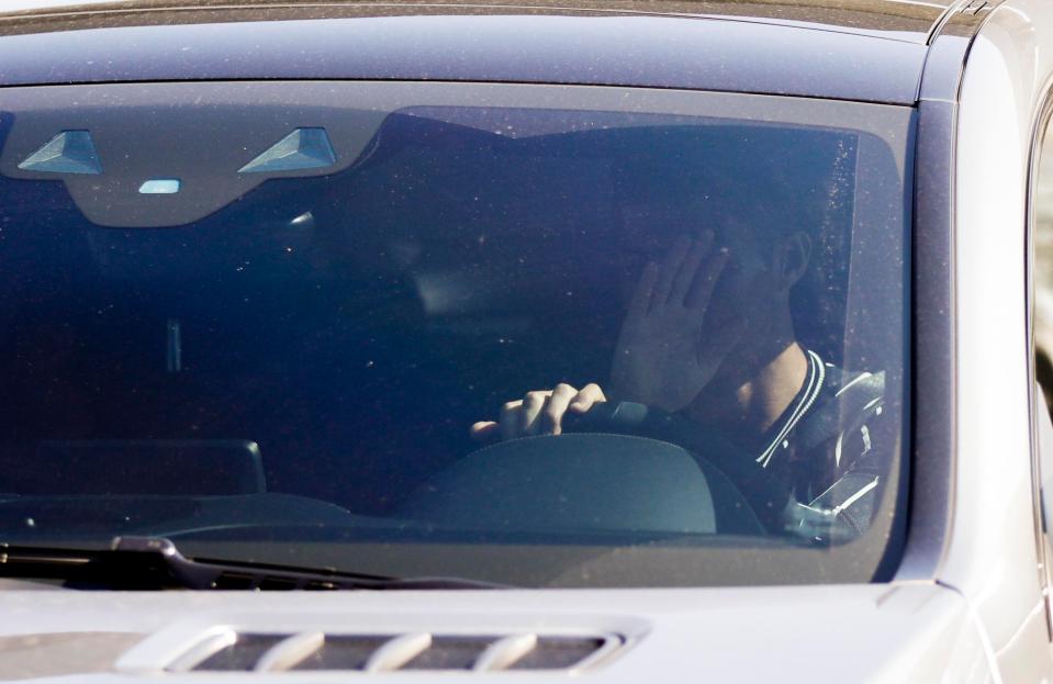  Cristiano Ronaldo covers his face as he leaves training with Juventus