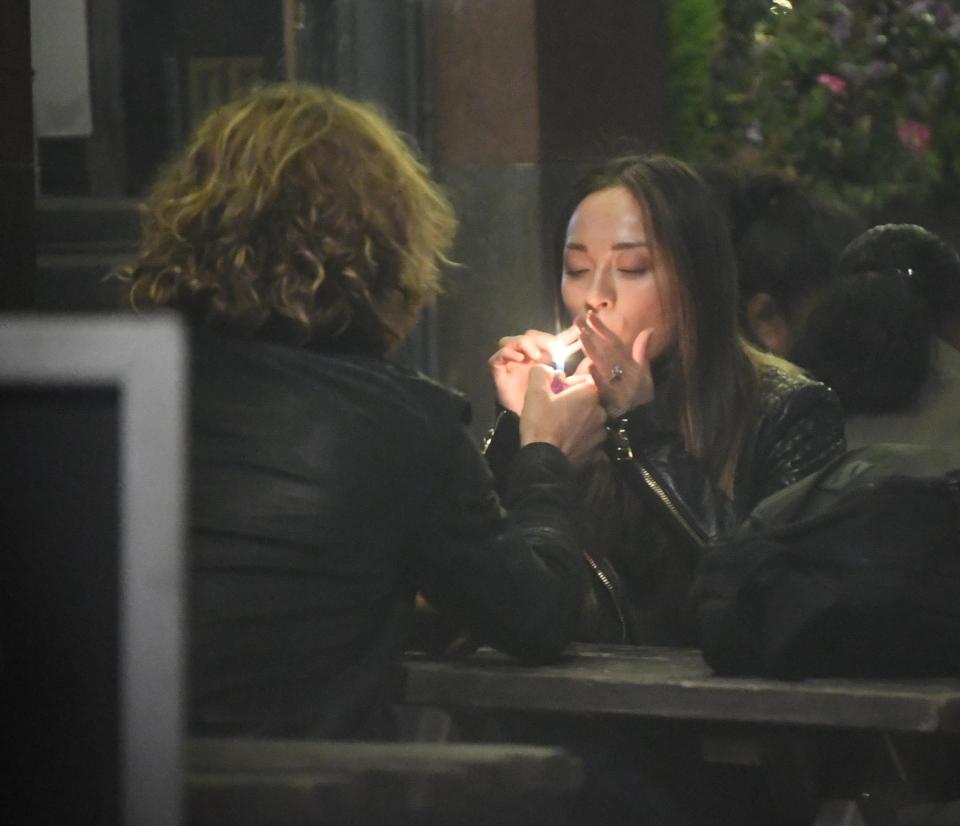  The ring on Katya's wedding finger is visible as she lights a smoke outside the Duke of York pub with Seann