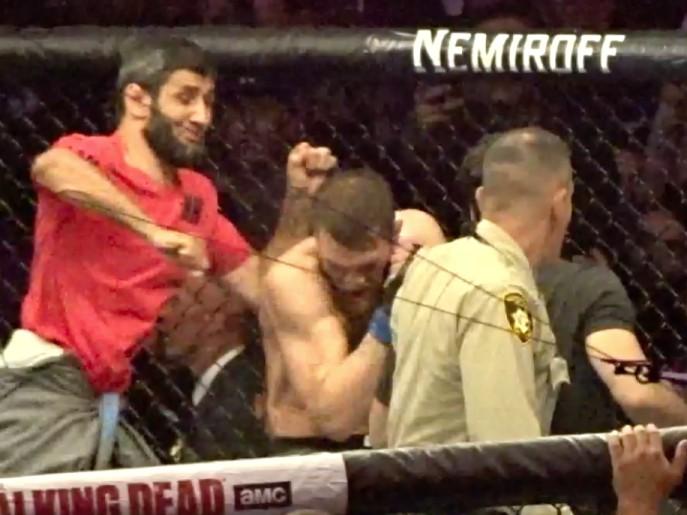 Members of Khabib Nurmagomedov’s team jumped into the octagon after the fight