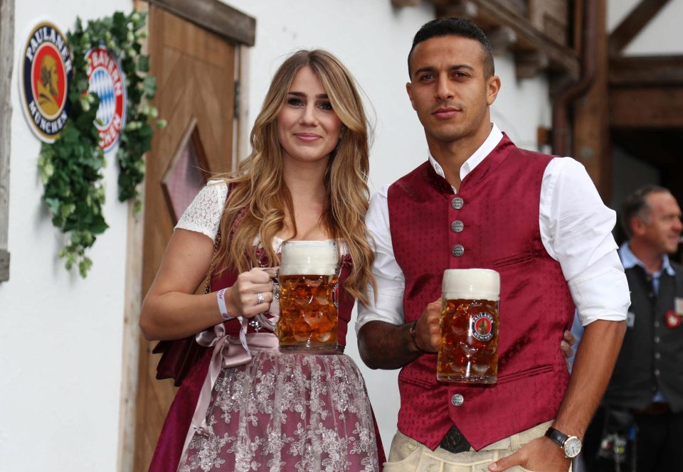  Spanish midfielder Thiago enjoys a stein of beer with wife Julia Vigas