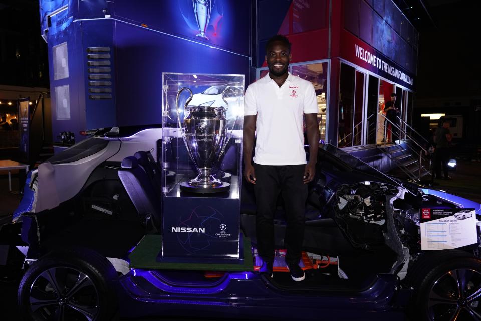  The Nissan ambassador poses next to the Uefa Champions League trophy, which he won in 2012