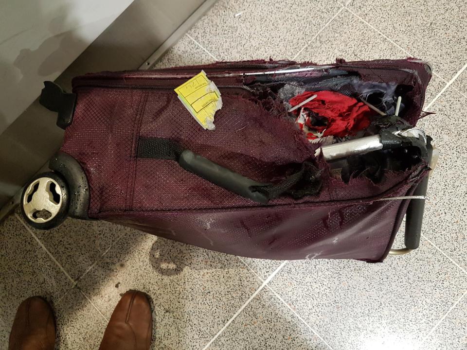  The couple say a suitcase was 'sodden wet' and ripped when they picked it up at the arrivals hall