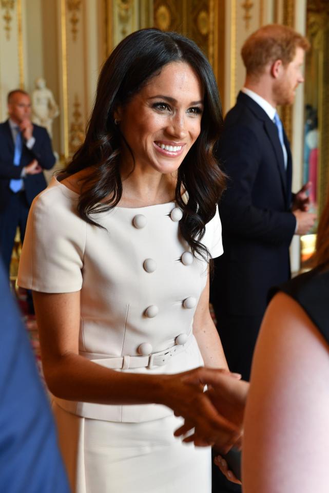  Greeting guests at the Queen's Young Leaders Awards Ceremony at Buckingham Palace