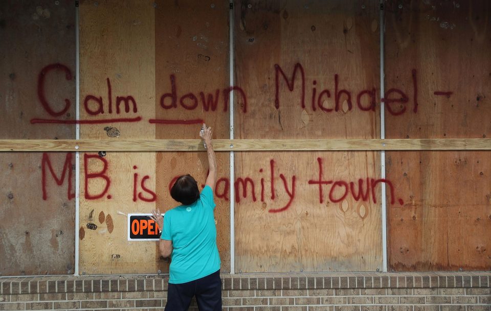 One resident writes 'Calm down Michael' while preparing for the Category 3 storm