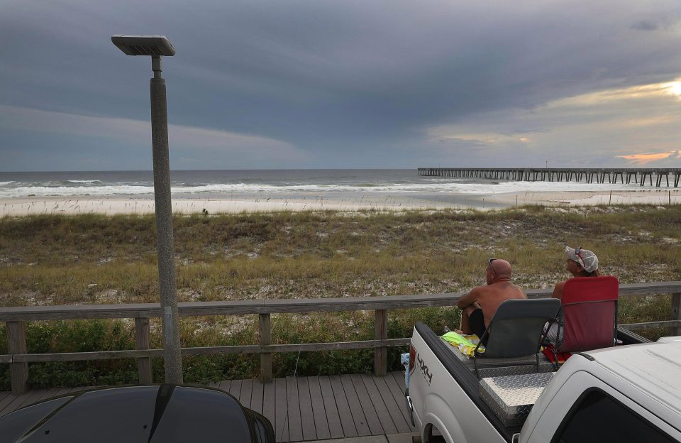  Residents watch the storm making its way towards the Florida coast