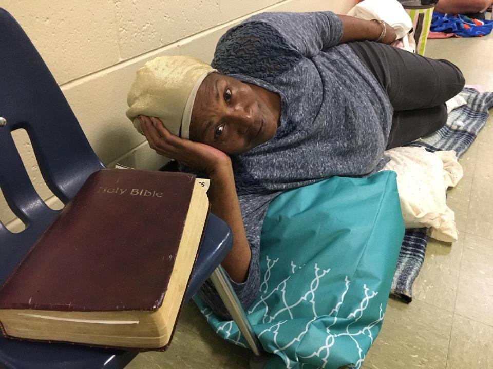  Betty Early, 75, reclines in a school hallway being used as a shelter from Hurricane Michael in Panama City, Florida