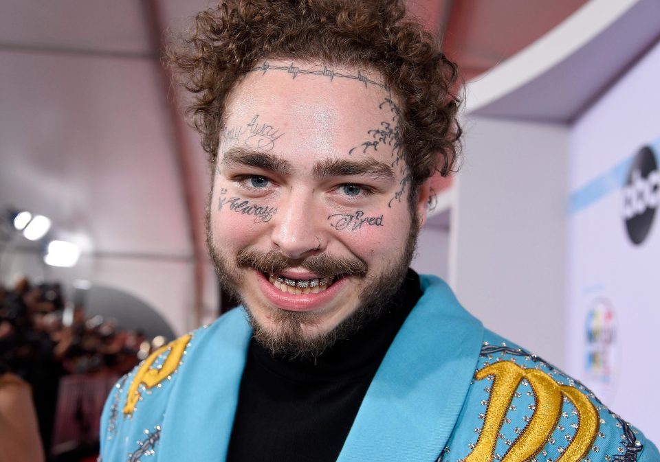  The rapper - pictured here - as face tattoos and curly hair