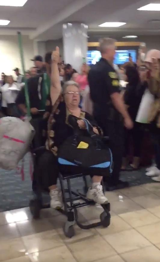  The woman was forcibly removed from the Frontier Airlines jet despite her protests