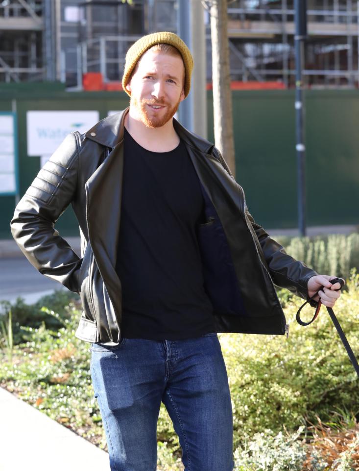  The professional dancer looked in good spirits as he walked their dog in London