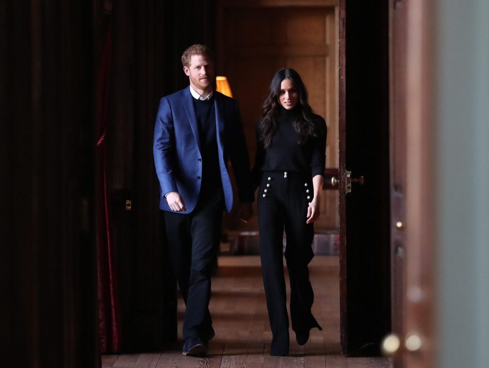  Walking through the corridors of the Palace of Holyroodhouse on their way to a reception for young people at the Palace