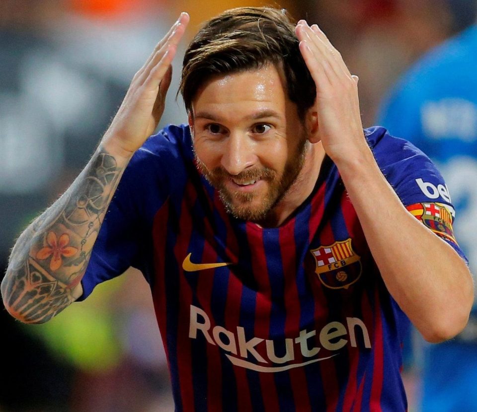 Lionel Messi celebrates scoring against Valencia