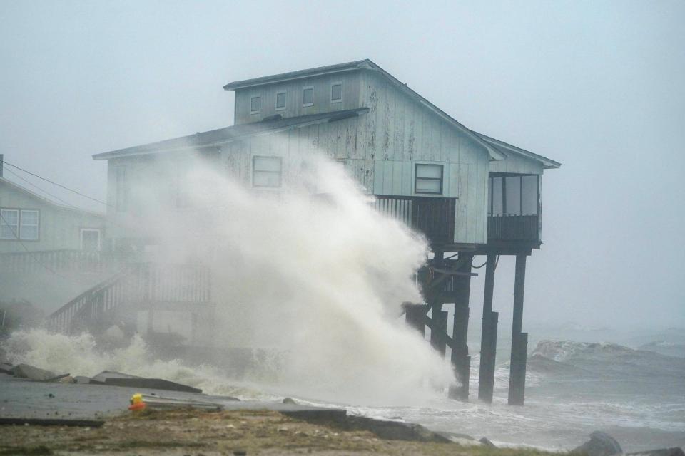  Waves take over a house as Hurricane Michael comes ashore in Alligator Point, Florida