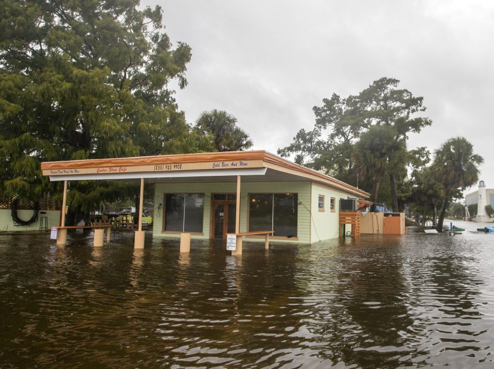  The Cooter Stew Cafe starts taking water in the town of Saint Marks after Michael pushed the storm surge inland