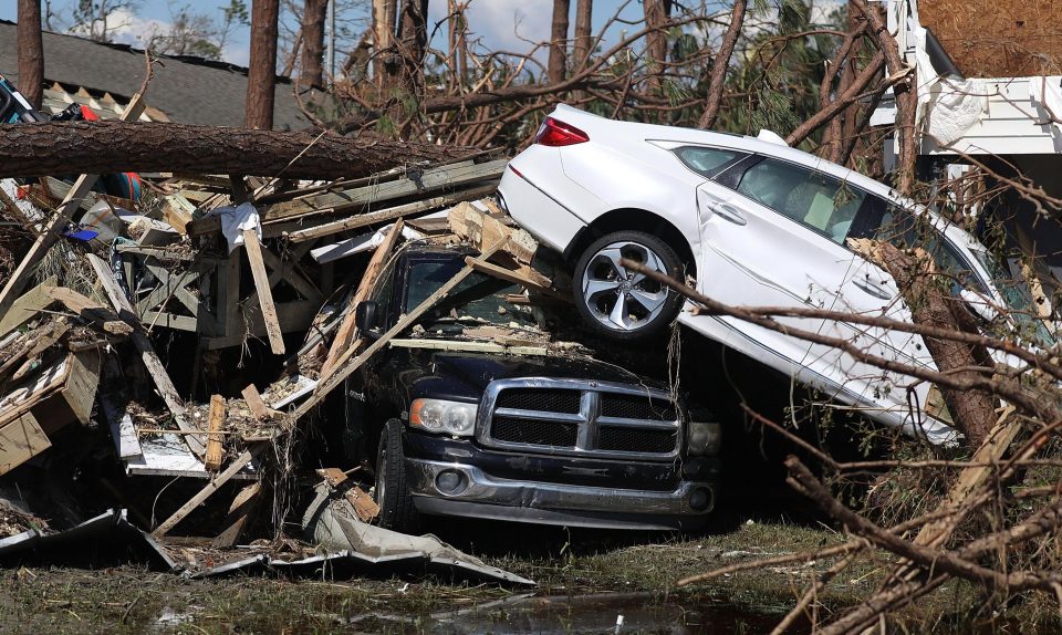  Cars are left upturned and covered by rubble