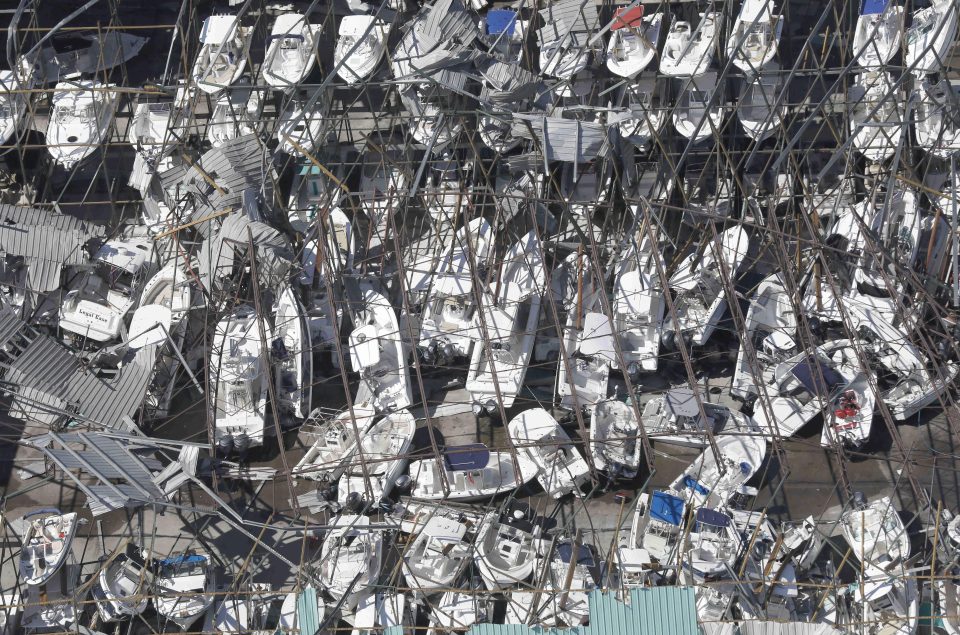  Dozens of private boats lie damaged in a harbour