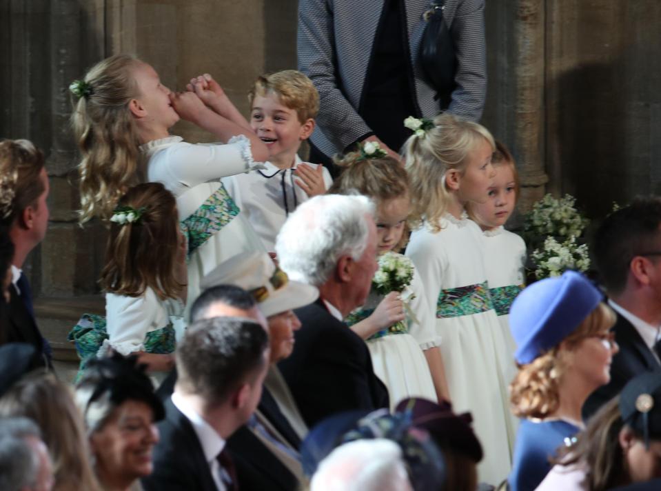  At the ceremony in Windsor on Friday, Savannah Phillips was seen pretending to play the trumpet as George giggled