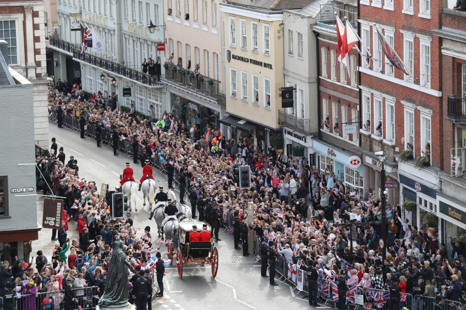  Princess Eugenie and Jack Brooksbank in the royal carriage on a crowded part of the route