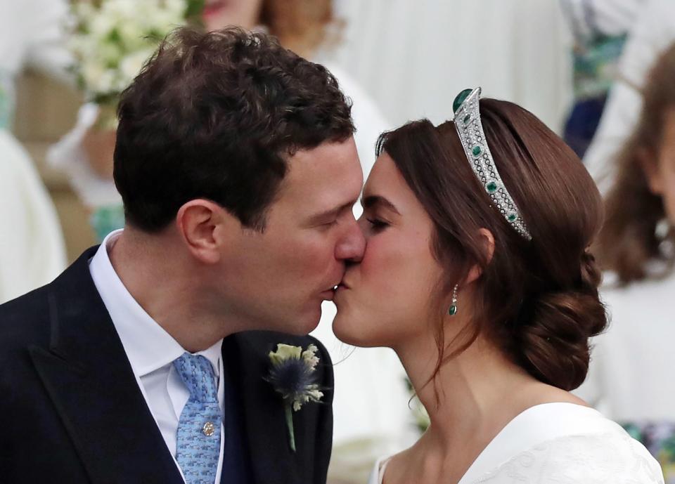  The bride stunned in her emerald and diamond tiara as she exited the chapel