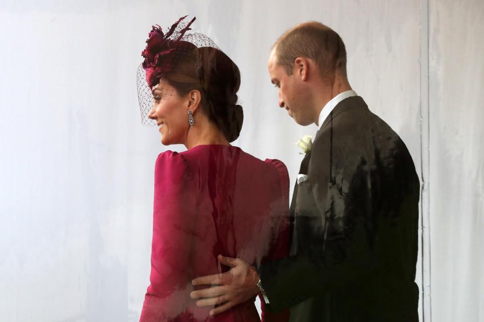  The Duke of Cambridge was seen placing his hand gently on his wife's back