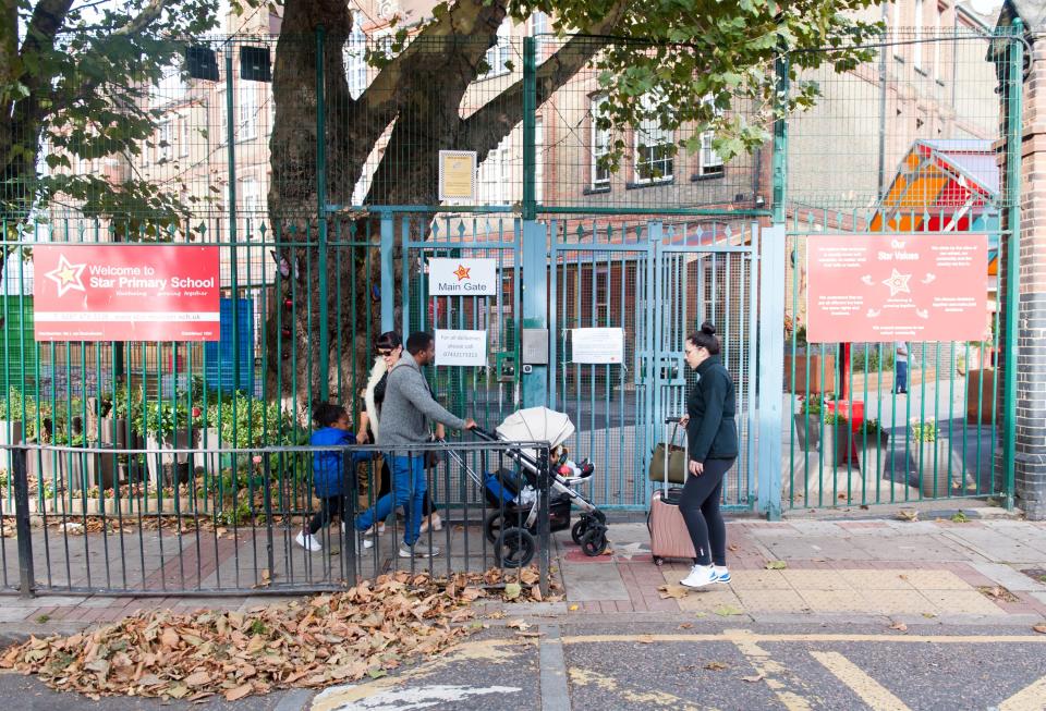  Parents outside Star Primary School in Canning Town, which has been closed after being invaded by false widow spiders