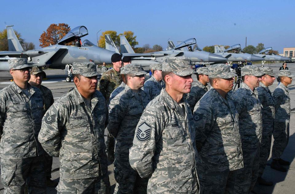  US servicemen stand in front of US F-15 fighter during an air force exercise at Starokostyantyniv military airbase