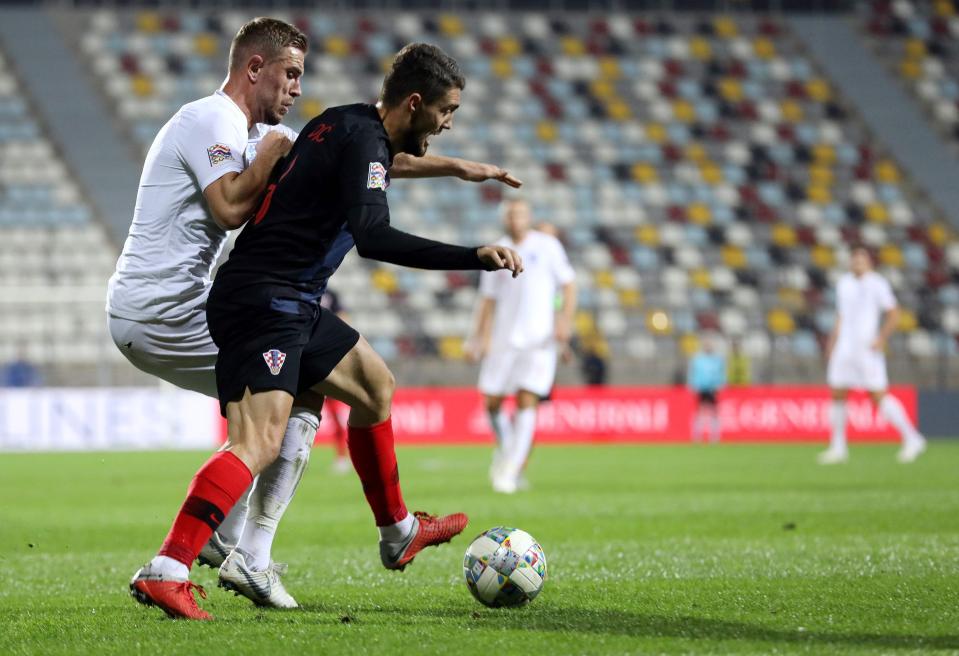  England ace Jordan Henderson battling for possession against Mateo Kovacic