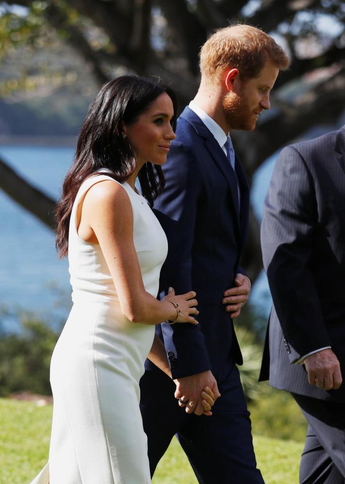  Meghan Markle unveiled a teeny-tiny baby bump in Sydney today