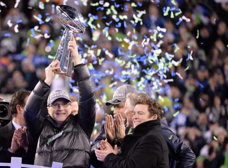  Allen holds the Vince Lombardi trophy after the Seahawks defeated the Denver Broncos in the NFL Super Bowl