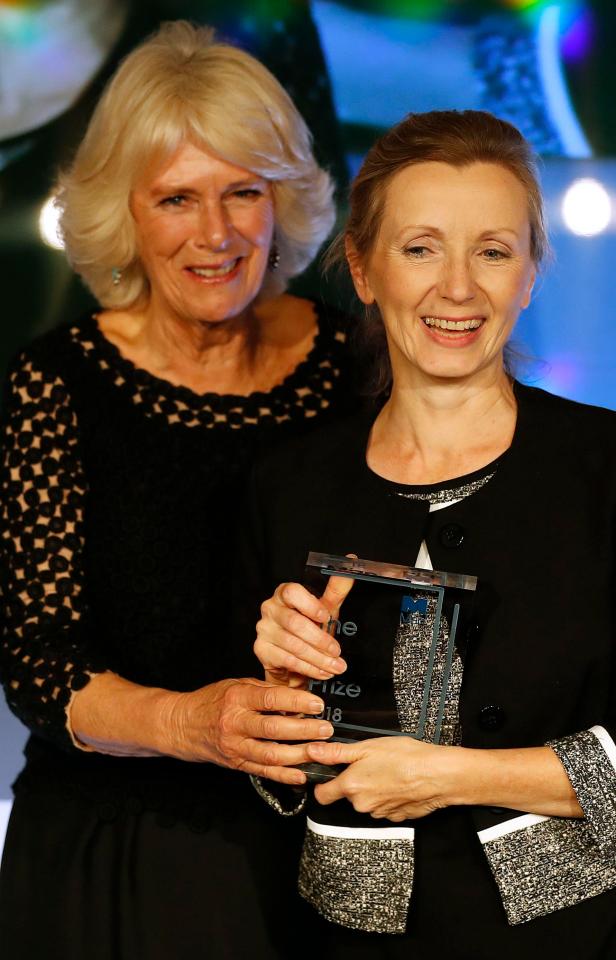  Camilla, the Duchess of Cornwall, presents the Man Booker Prize for Fiction 2018 to British writer Anna Burns during the prize's 50th year at the Guildhall in London