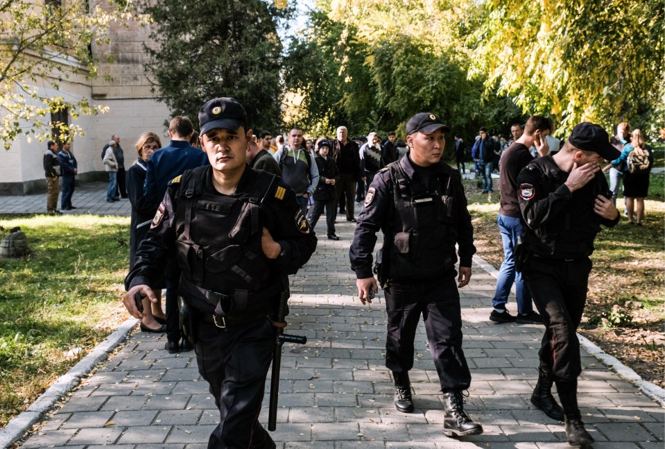 Law enforcement agency officers outside the building of the Kerch Polytechnic Vocational School in the city of Kerch